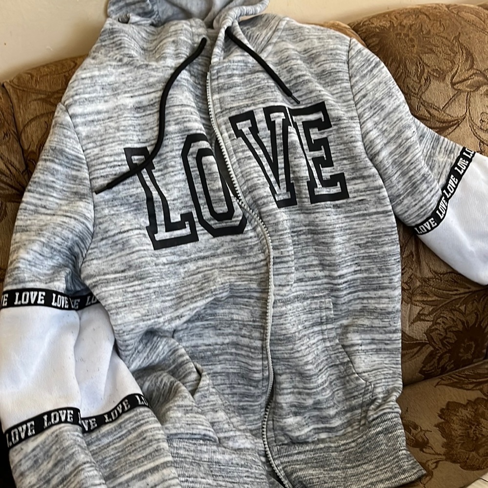 This is a great hoodie with love in the middle and on the arms.